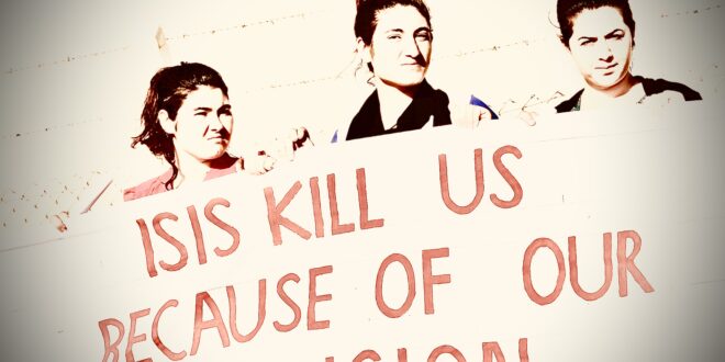 Yazidi refugee women stand behind a banner as they wait for the arrival of United Nations High Commissioner for Refugees Special Envoy Angelina Jolie at a Syrian and Iraqi refugee camp in the southern Turkish town of Midyat in Mardin province, Turkey, June 20, 2015. REUTERS/Umit Bektas
